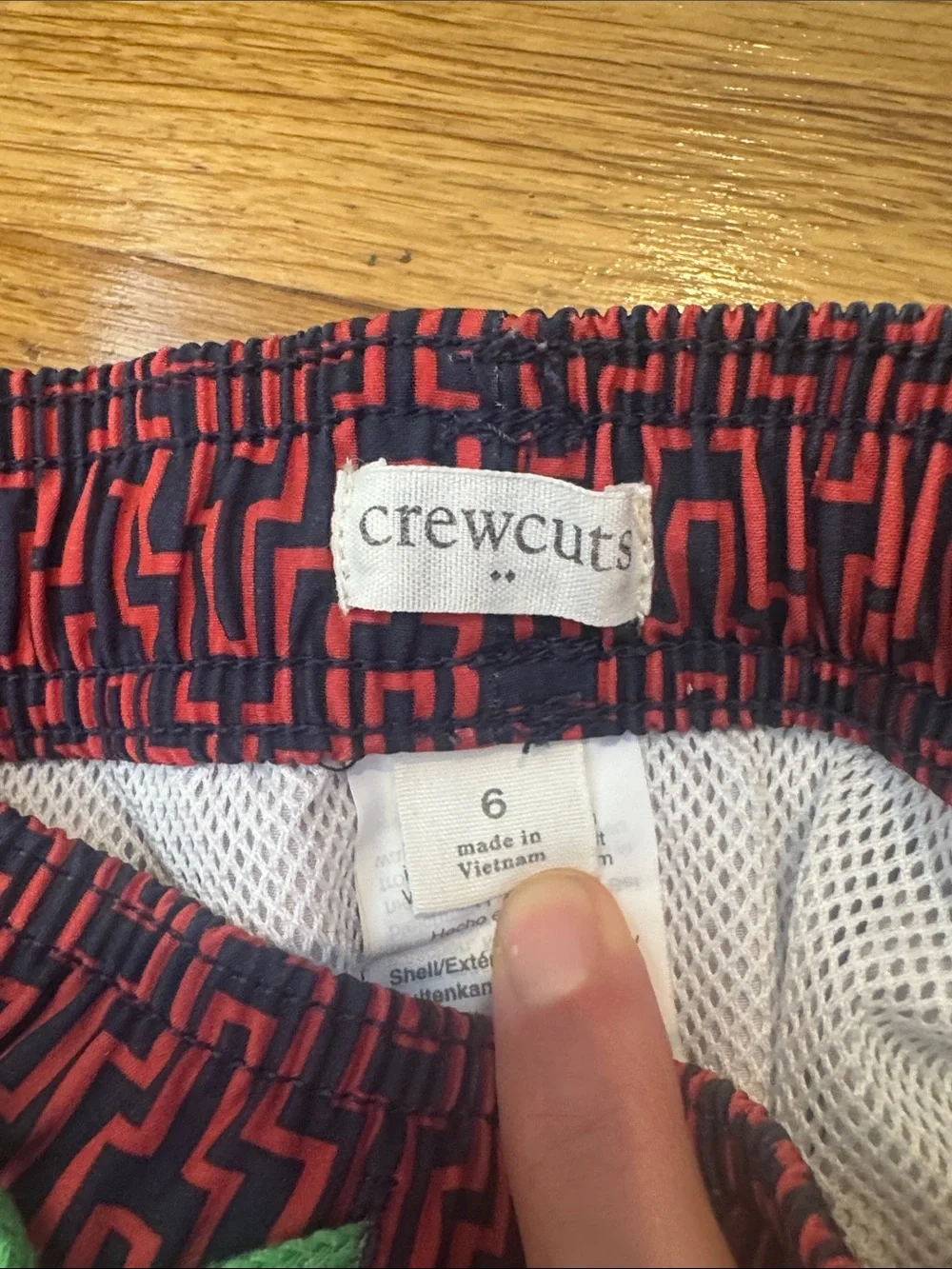 Crewcuts Red and Black Geometric Swim Trunks with Neon Green Drawcord